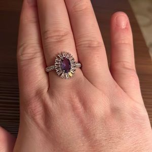 Stunning purple lab created tanzanite ring with cubic zirconia accents.